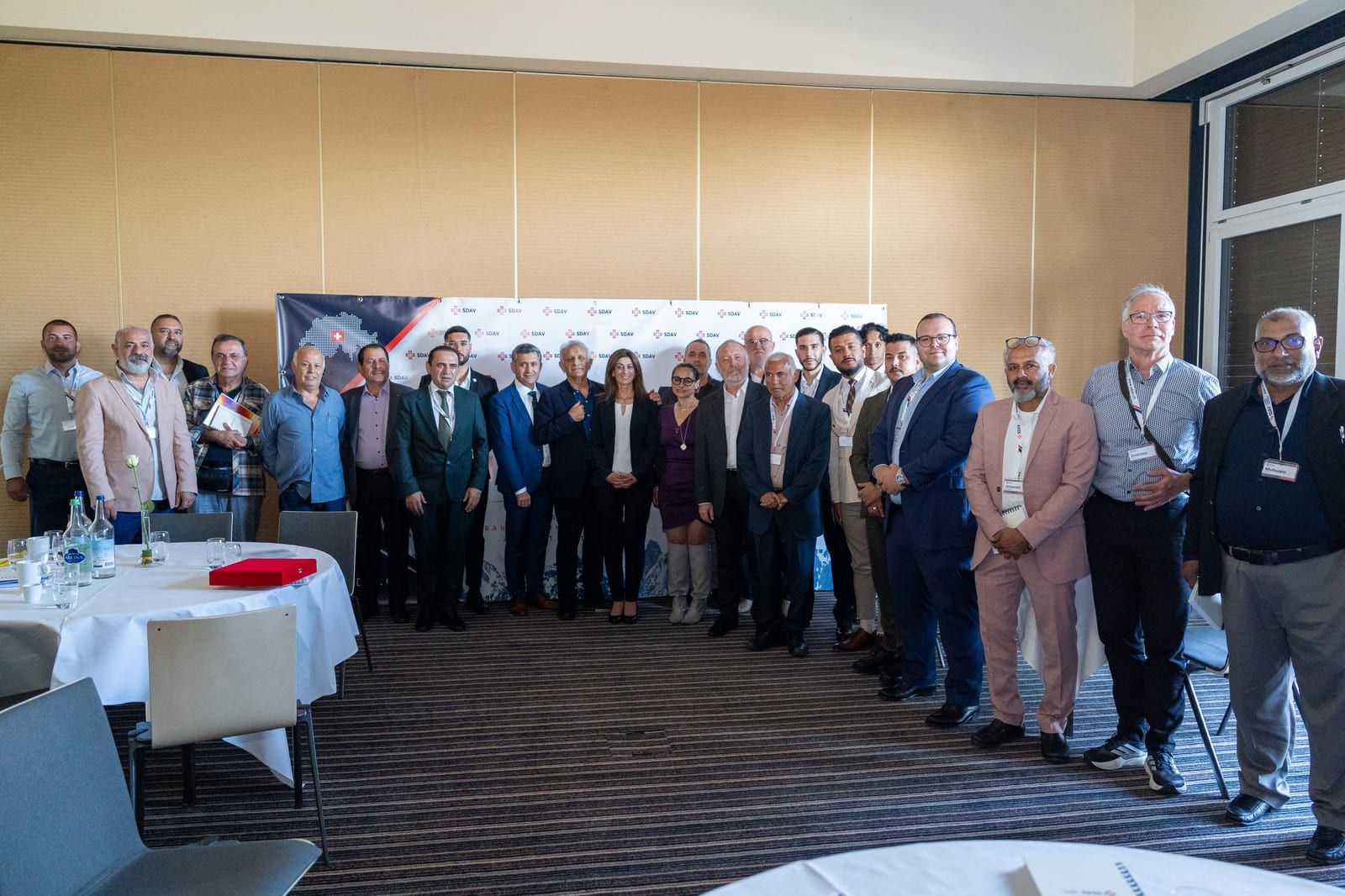 Group photograph of the participants standing in rows in front of the SDAV backdrop at the end of the day.